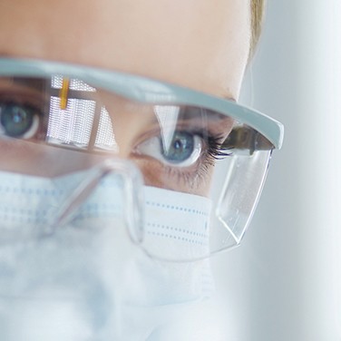 Scientist wearing protective goggles