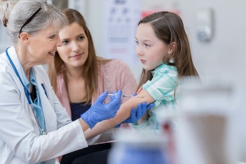 A girl getting a vaccine